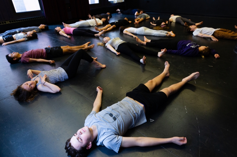 Summer High School Drama students lay on the floor of an acting studio